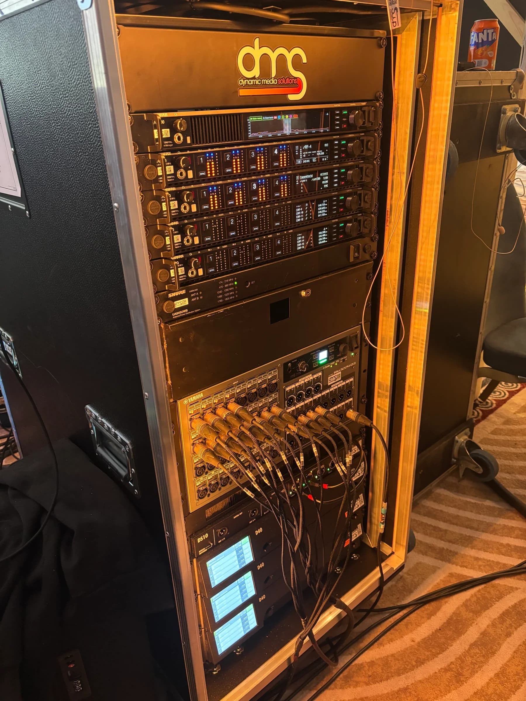 DMS audio equipment rack with illuminated controls and connected cabling